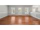 Living room featuring hardwood floors, white trim, and natural light at 2545 Rea Rd, Charlotte, NC 28226