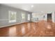 Living room with hardwood floors, white trim, and lots of natural light at 2545 Rea Rd, Charlotte, NC 28226