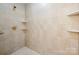 Shower with tiled walls, decorative tiled accent, and built-in corner shelves at 2545 Rea Rd, Charlotte, NC 28226