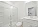 A bright bathroom with white fixtures and a tiled shower for a clean and modern feel at 4018 Capital Ridge Ct, Charlotte, NC 28205