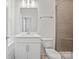 Clean, bright bathroom features modern vanity, toilet, and tiled shower with glass doors at 4018 Capital Ridge Ct, Charlotte, NC 28205