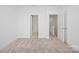 Bedroom featuring neutral carpet, white walls, and doorway leading to additional rooms at 4018 Capital Ridge Ct, Charlotte, NC 28205