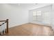 Spacious bonus room featuring a large window and hardwood flooring at 4018 Capital Ridge Ct, Charlotte, NC 28205