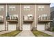 Townhome exterior with garage and balconies featuring neutral siding and manicured lawns with a well maintained driveway at 4018 Capital Ridge Ct, Charlotte, NC 28205