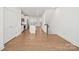 Open concept living space boasts hardwood floors, recessed lighting, and modern kitchen with island at 4018 Capital Ridge Ct, Charlotte, NC 28205