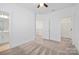 Spacious main bedroom with neutral carpet, a ceiling fan and a door to ensuite bathroom at 4018 Capital Ridge Ct, Charlotte, NC 28205