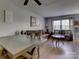 Spacious dining area with wood table and leather sofas at 4609 Coronado Dr # O, Charlotte, NC 28212