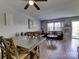 Dining area with wood table and chairs, adjacent to living room at 4609 Coronado Dr # O, Charlotte, NC 28212