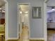 Bright hallway with wood flooring, leading to bedrooms and bath at 4609 Coronado Dr # O, Charlotte, NC 28212