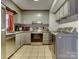 Galley kitchen with stainless steel appliances and granite countertops at 4609 Coronado Dr # O, Charlotte, NC 28212