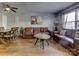 Spacious living room featuring hardwood floors and a leather sofa at 4609 Coronado Dr # O, Charlotte, NC 28212