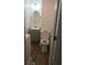 Bathroom features a toilet, vanity, light fixture, and wood flooring at 605 N Mcfarland N St, Gastonia, NC 28054
