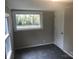 A cozy bedroom featuring soft gray walls and plush carpeting for ultimate comfort at 605 N Mcfarland N St, Gastonia, NC 28054
