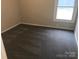 Bright bedroom with neutral walls and gray carpet, ready for personalization at 605 N Mcfarland N St, Gastonia, NC 28054