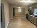 Kitchen showcasing gray cabinets, stainless appliances, tile backsplash, and an open layout at 605 N Mcfarland N St, Gastonia, NC 28054