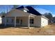 Rear exterior view of the home showing covered patio and ample backyard space at 217 Heartland Dr, Rock Hill, SC 29732