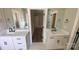 Bright bathroom featuring dual vanities, modern fixtures, and a door leading to a tiled shower at 217 Heartland Dr, Rock Hill, SC 29732