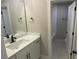 Modern bathroom with white vanity, black fixtures, and a view into the tiled shower area at 217 Heartland Dr, Rock Hill, SC 29732