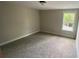Spacious bedroom is carpeted and features a window offering natural light and a view at 217 Heartland Dr, Rock Hill, SC 29732
