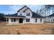 Back view of house showcasing its light-yellow siding and a covered porch area at 217 Heartland Dr, Rock Hill, SC 29732