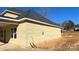 Side view of the house showcasing its light-yellow siding and a covered porch at 217 Heartland Dr, Rock Hill, SC 29732