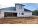 View of the house's back, highlighting the garage and back porch at 217 Heartland Dr, Rock Hill, SC 29732