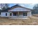 House's back exterior with a covered patio and dark gray roof at 217 Heartland Dr, Rock Hill, SC 29732