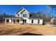 Newly constructed two-story home with gray and white siding and a covered front porch at 217 Heartland Dr, Rock Hill, SC 29732