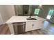 Open concept kitchen with a stone fireplace view, featuring a large island and modern appliances at 217 Heartland Dr, Rock Hill, SC 29732