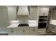 Close-up of the white cabinets, stainless steel appliances, and subway tile backsplash in the kitchen at 217 Heartland Dr, Rock Hill, SC 29732