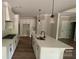Gourmet kitchen featuring white cabinets, gas cooktop, double ovens and a large center island at 217 Heartland Dr, Rock Hill, SC 29732