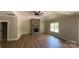 Spacious living room featuring a stone fireplace, ceiling fan and wood-look floors at 217 Heartland Dr, Rock Hill, SC 29732