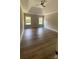 Spacious main bedroom with trey ceilings, two windows and wood-look floors at 217 Heartland Dr, Rock Hill, SC 29732