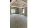 A spacious bedroom with two windows offering natural light and a tray ceiling at 227 Heartland Dr, Rock Hill, SC 29732