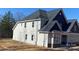 Side view of a new home showing the siding and roof details, plus a view of the yard at 227 Heartland Dr, Rock Hill, SC 29732