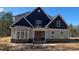 Beautiful new construction home featuring board and batten siding and a welcoming front porch at 227 Heartland Dr, Rock Hill, SC 29732