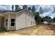 Exterior side view of the home featuring neutral siding and white gutters at 227 Heartland Dr, Rock Hill, SC 29732