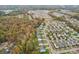 Aerial view of neighborhood and surrounding area at 2624 Woodlands Creek Dr, Monroe, NC 28110