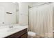 Small bathroom with shower/tub combo and patterned curtain at 2624 Woodlands Creek Dr, Monroe, NC 28110