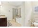 Bathroom with double vanity, shower, and bathtub at 2624 Woodlands Creek Dr, Monroe, NC 28110