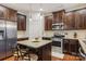 Kitchen with granite island and stainless steel appliances at 2624 Woodlands Creek Dr, Monroe, NC 28110