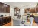 Modern kitchen with dark wood cabinets and granite countertops at 2624 Woodlands Creek Dr, Monroe, NC 28110