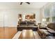 Living room with hardwood floors and a view into the kitchen at 2624 Woodlands Creek Dr, Monroe, NC 28110