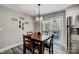 Cozy dining area featuring a modern light fixture and sliding doors to the outside patio at 3018 Corinth Church Rd, Monroe, NC 28112