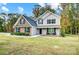 Lovely two-story house with brick and vinyl siding, black shutters, and a cozy front porch at 3018 Corinth Church Rd, Monroe, NC 28112