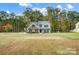 Beautiful two-story home with brick and siding, set on a large lot with mature trees at 3018 Corinth Church Rd, Monroe, NC 28112