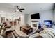 Open-concept living room with modern finishes, a fireplace, and a view of the kitchen area at 3018 Corinth Church Rd, Monroe, NC 28112