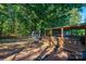 Backyard with a wooden pergola and a grassy area at 3401 Stony Brook Cir, Newton, NC 28658