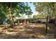 Backyard view of house, patio, and storage shed at 3401 Stony Brook Cir, Newton, NC 28658