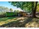 House backyard view with deck and large shade trees at 3401 Stony Brook Cir, Newton, NC 28658